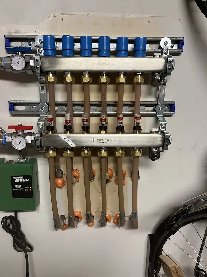 Plumber performing Water Heater Repair at a residential property in Carlstadt